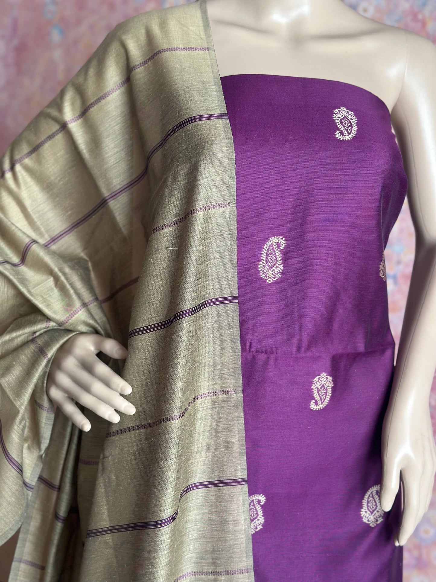 Purple paisley top fabric and silver-beige striped dupatta draped on a mannequin