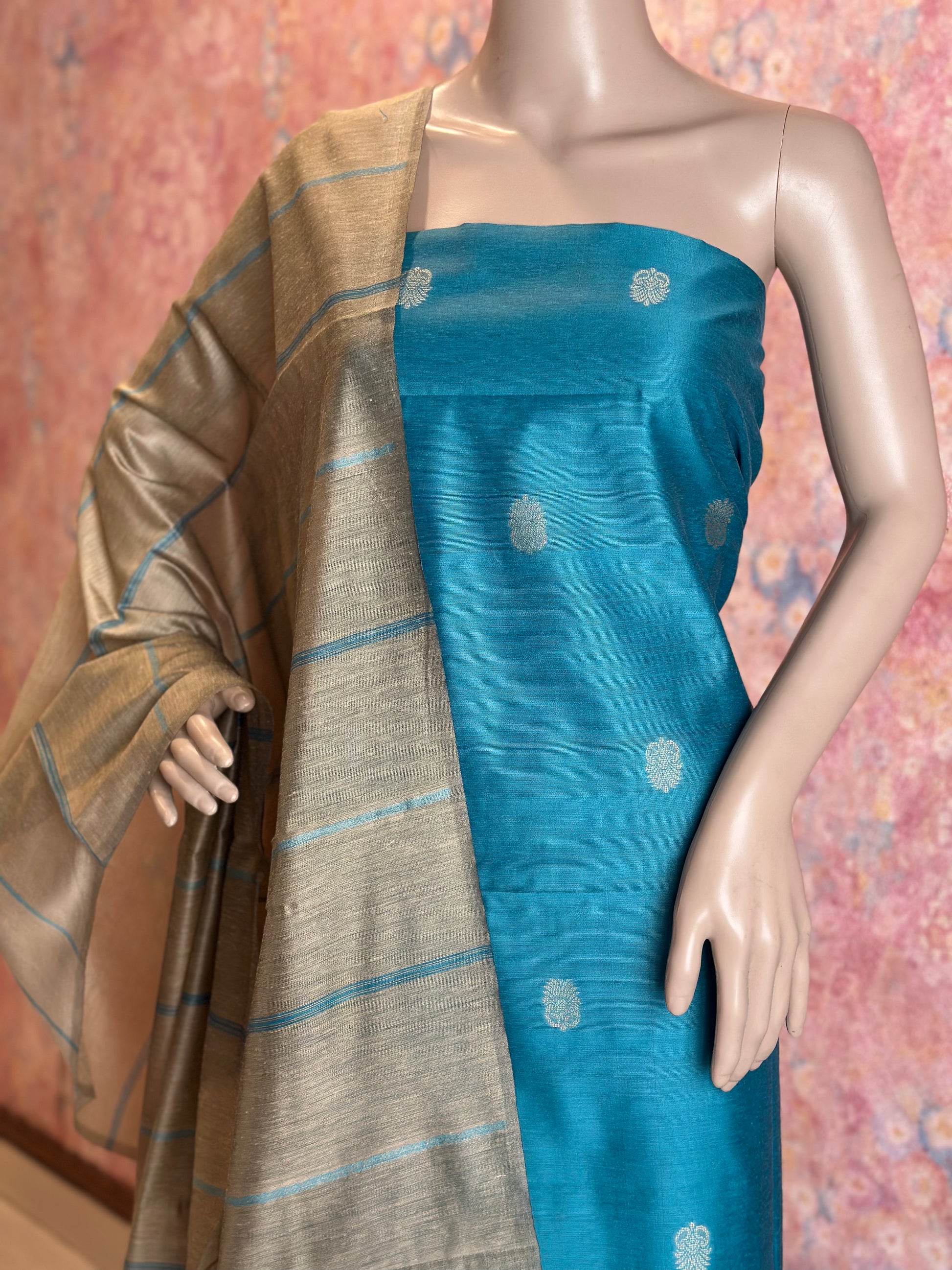 Light Blue patterned silk cotton top fabric and contrasting striped dupatta draped on a mannequin.