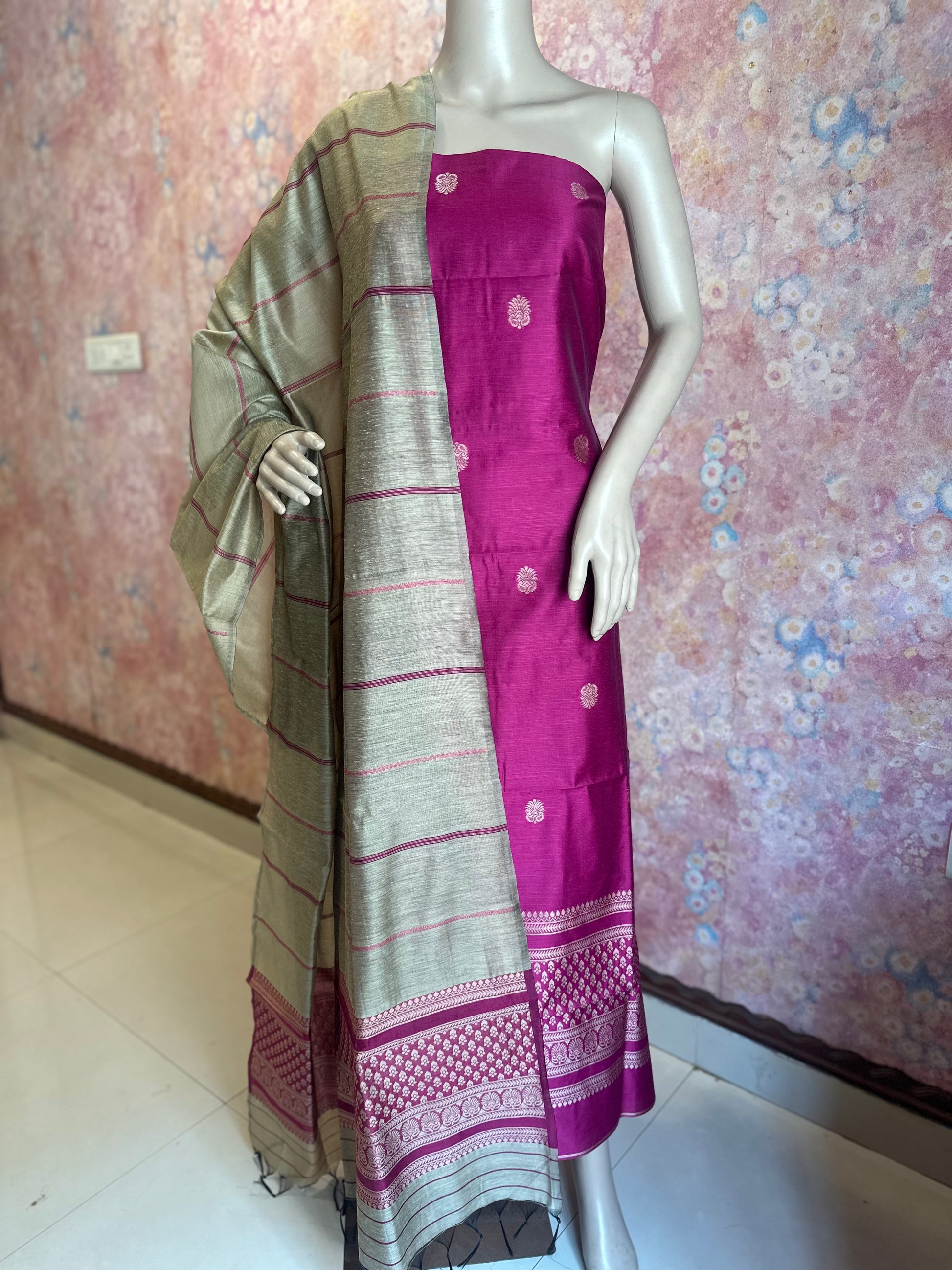 Dark Pink silk cotton fabric with woven motifs and contrasting striped dupatta draped on a mannequin