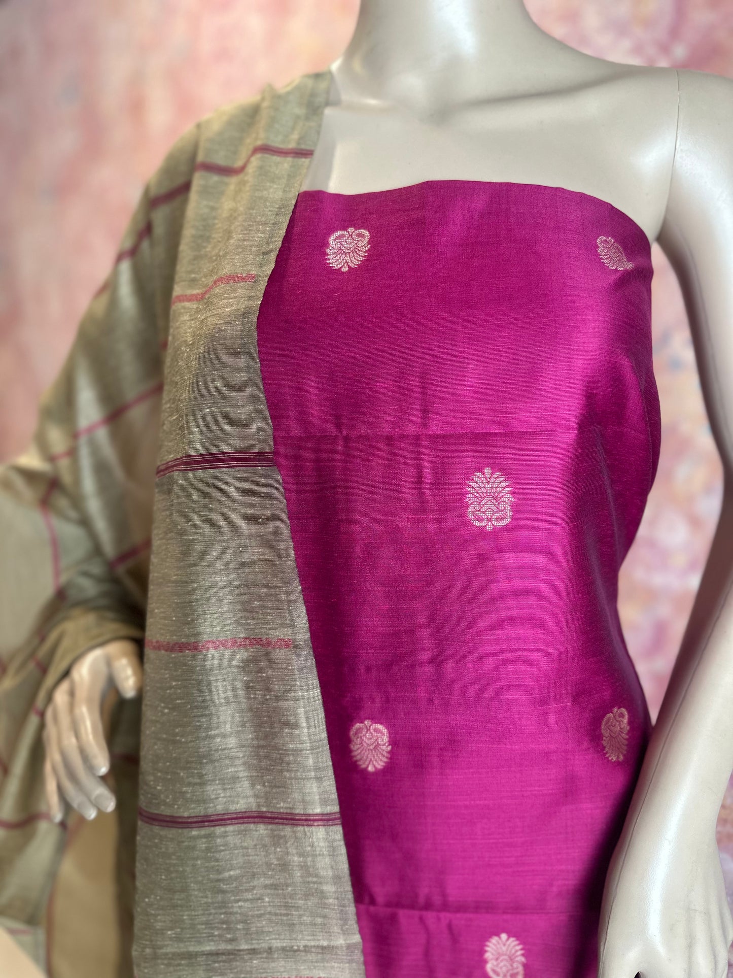 Close-up of woven motifs on Dark Pink silk cotton top fabric beside the contrasting dupatta