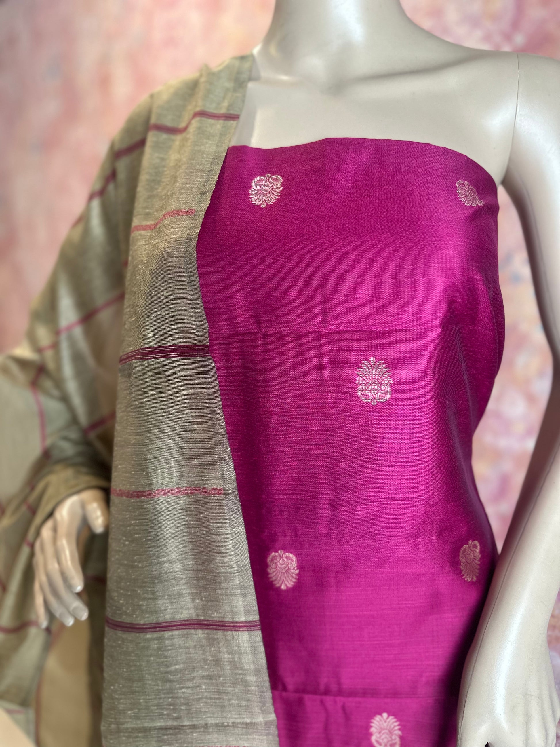 Close-up of woven motifs on Dark Pink silk cotton top fabric beside the contrasting dupatta