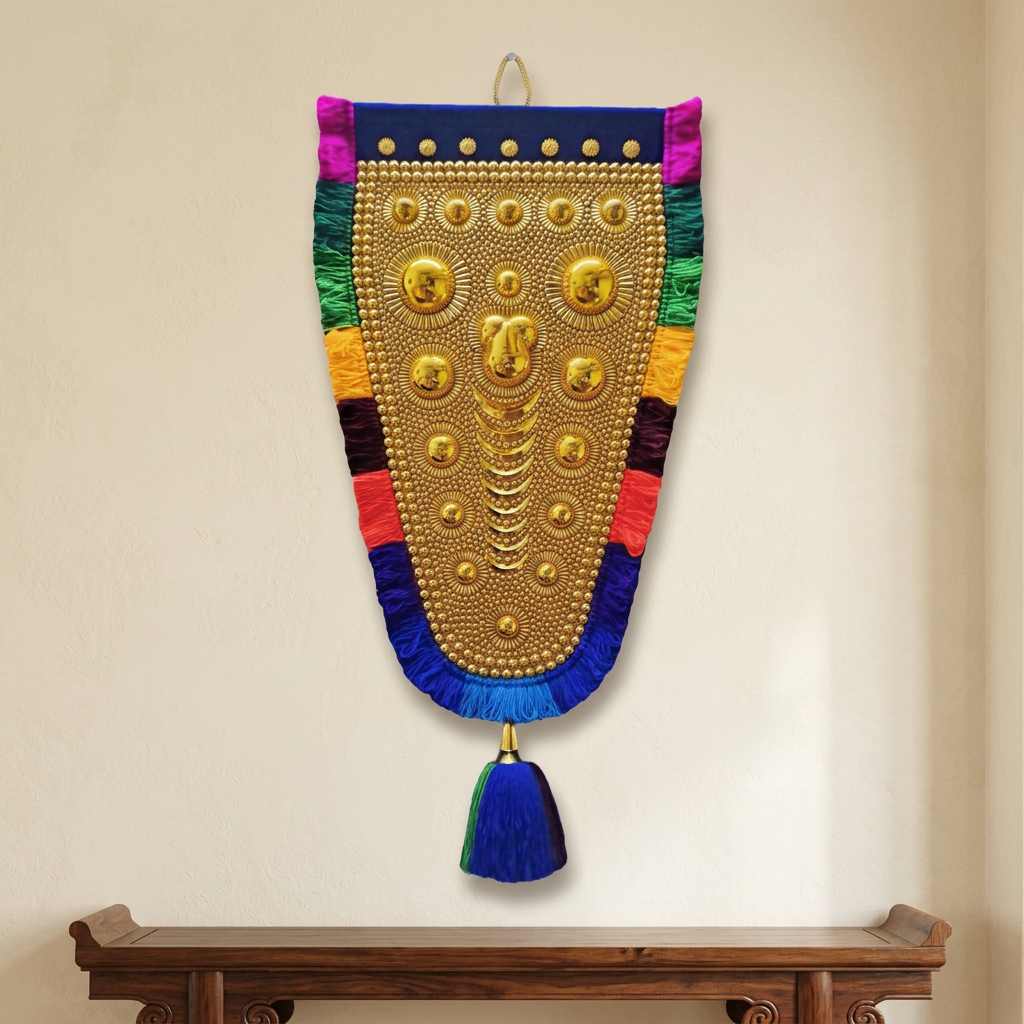 3 Ft gold-toned Nettipattam with multicolour fringe and blue tassel displayed on an ivory wall above a wooden console